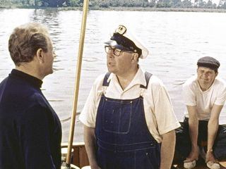 Drei Mann in einem Boot