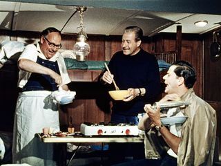 Drei Mann in einem Boot